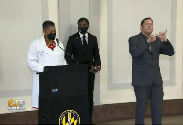 Johns Hopkins staff participating in a press conference for WJZ-13